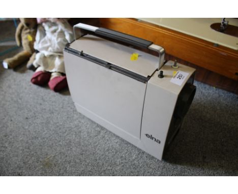A VINTAGE ELNA ELECTRIC SEWING MACHINE 