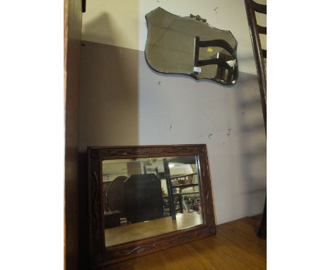 A CARVED OAK MIRROR AND AN ART DECO MIRROR (2)