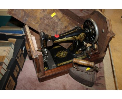 A VINTAGE SINGER SEWING MACHINE TOGETHER WITH A VINTAGE IRON (2)