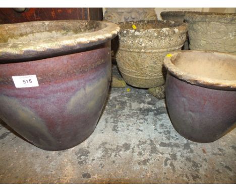 A RAISED PLANTER TOGETHER WITH TWO GLAZED PLANT POTS