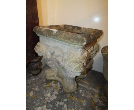 A SQUARE PLANTER WITH LION DETAIL