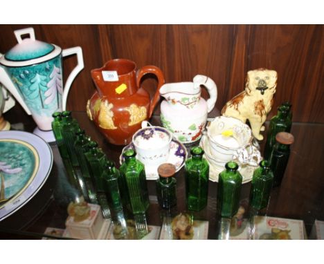 A COLLECTION OF VINTAGE CERAMICS TO INCLUDE A STAFFORDSHIRE STYLE DOG PLUS A QUANTITY OF SMALL GREEN GLASS BOTTLES 