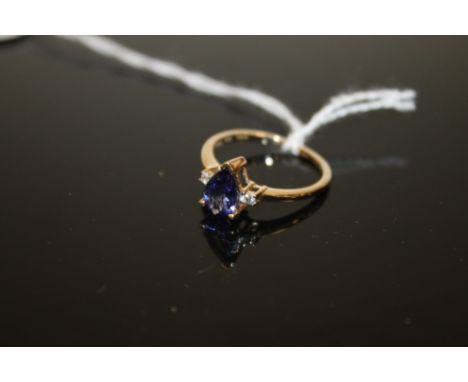 A HALLMARKED 9K GOLD AAA PEAR SHAPED TANZANITE RING, coming with certificate stating stone is 1.26 carats measuring 9 mm x 6 