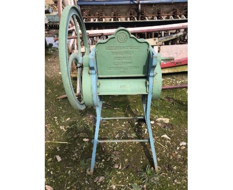 A VINTAGE AGRICULTURAL CAKE CRUSHER BY R BAMFORD & SONS