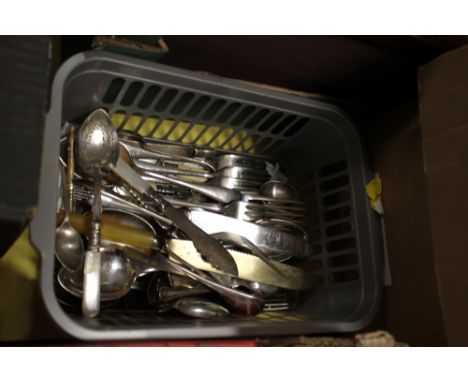 A BASKET OF VINTAGE CUTLERY