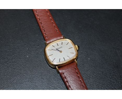 A LADIES TISSOT AUTOMATIC WRIST WATCH ON LEATHER STRAP