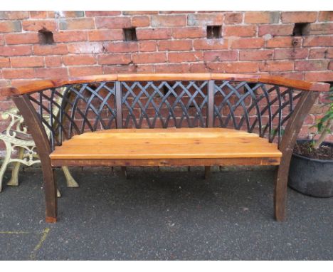 A CURVED WOODEN AND CAST BACK GARDEN BENCH W-160 CM
