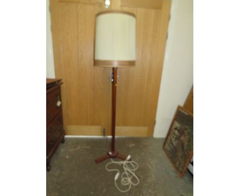 A MID CENTURY TEAK STANDARD LAMP WITH SHADE