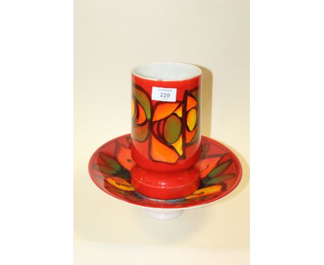 A RETRO PATTERN POOLE POTTERY VASE AND BOWL
