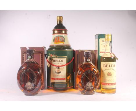 Four bottles of blended Scotch whisky to include BELLS Extra Special 40% abv. 70cl, BELLS Christmas 1991 40% abv. 70cl and tw
