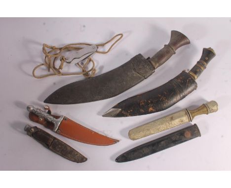 British war department issue folding pocket knife, two Gurkha kukris, three other knives and a steel scabbard.