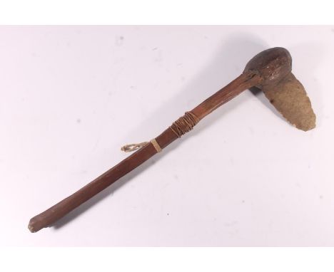 Oceanic South Seas or Papua New Guinea style stone axe with bird's head shaped head, 45cm long.