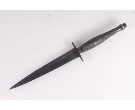 British post WWII Fairbairn Sykes FS commando dagger of typical form having blue steel blade, the grip stamped with War Depar