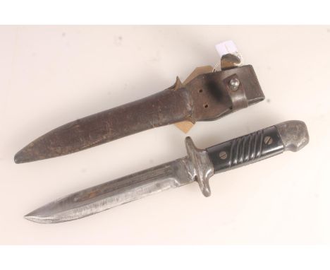Unusual German WWI style trench knife, the blade with squared off fuller, the hilt stamped '24509' with black plastic grips, 