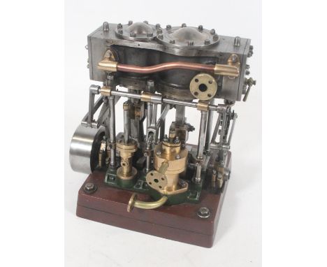 Live steam table top model of an engine, 19cm tall. The model weighs 4.12kg and moves freely.