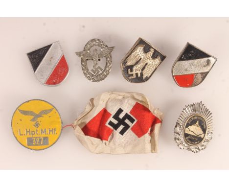German WWII era airfield workers badge 'L.Hpt.M.Hf 327', two national shield badges and a German tropical pith helmet eagle a