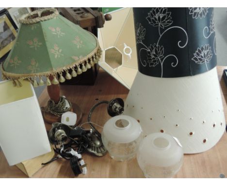 A treen table lamp and selection of lamp shades etc