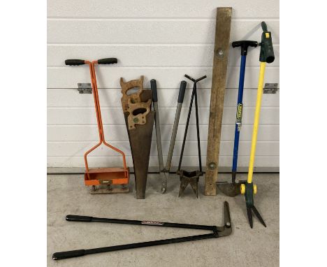 A collection of garden and maintenance tools. To include: Spear &amp; Jackson saws, lawn edger's, edging shears, soil extract