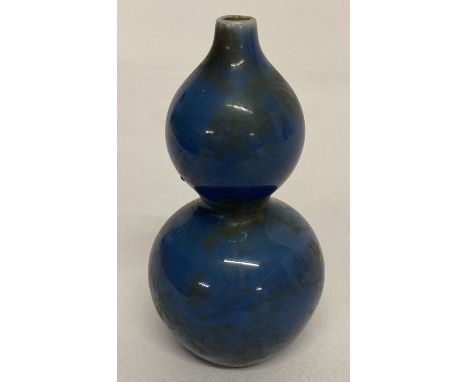 A Chinese ceramic bottle gourd shaped water dropper with blue glaze. Printed signature to underside. Approx. 11cm tall.