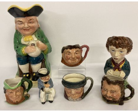 A collection of 7 assorted vintage ceramic toby jugs to include Royal Doulton and Cooper Clayton. Lot also includes large win