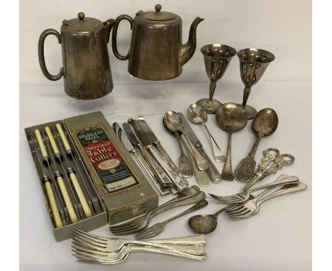 A collection of vintage silver plated cutlery, together with decorative grape scissors and goblets. Lot also includes a teapo