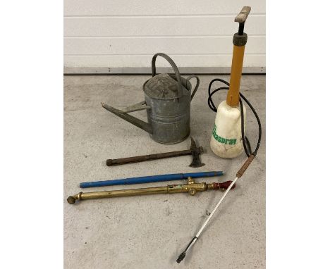 A small collection of gardening tools to include a brass sprayer, galvanised watering can &amp; an axe. . 