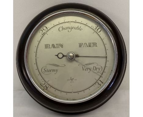 A vintage British made circular bakelite cased barometer.  Approx. 18cm diameter.