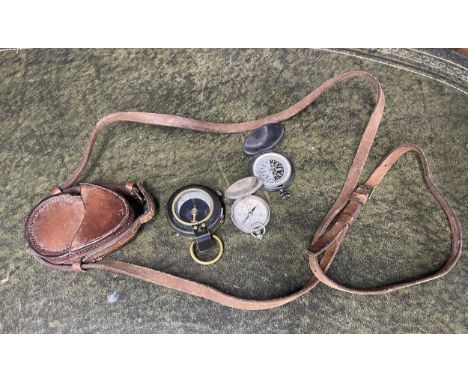 WWI Verners pattern VIII brass cased compass; in a leather carry case with strap; together with two further compasses (3). 