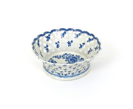 A large Bow blue and white basket, c.1770, the flared pierced sides painted with blue flowerheads to the exterior and with sh