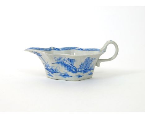 A Bow blue and white sauceboat, c.1752-55, the flat-bottomed form painted in a bright blue with the Desirable Residence patte