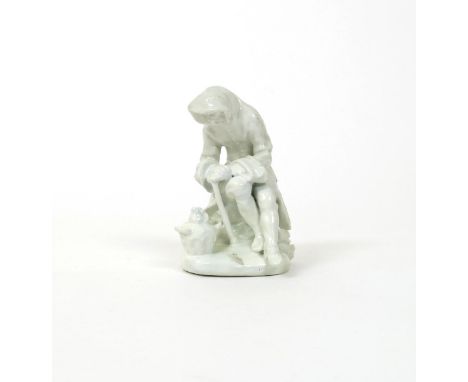 A Bow white-glazed figure of Winter, c.1755, from the Rustic Seasons series, modelled as an old man huddled over a flaming br