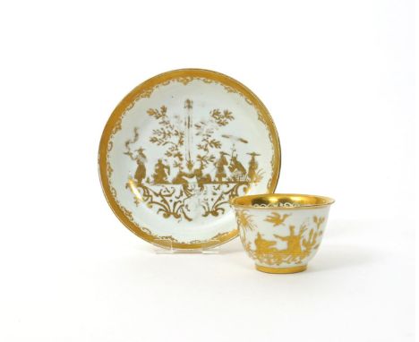 A Meissen Hausmaler teabowl and saucer, c.1725, decorated in Augsburg with gilt chinoiserie scenes, the saucer with figures s