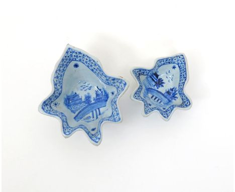 Two delftware deep pickle dishes, 2nd half 18th century, each of leaf shape, painted in blue to the interior with pagodas bes