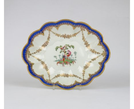 A Worcester lobed dessert dish, c.1780, the well painted with a fancy bird perched on a grassy mound with a further bird perc