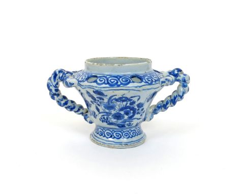 A rare London delftware bulb pot, c.1680-90, of inverted pear shape, painted in blue with butterflies in flight above Orienta