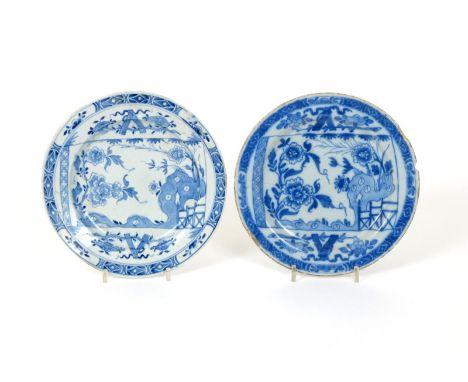 A Bow blue and white plate, c.1750, painted with the Broken Scroll pattern, the unfurled manuscript depicting flowering peony