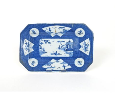 A small Bow elongated octagonal dish, c.1760, the central rectangular panel painted with a figure in a boat, the rim with fan