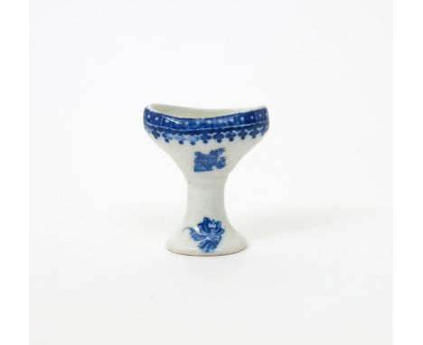A Caughley blue and white eyebath, c.1775, printed with excerpts from the Fisherman and Cormorant pattern, the rim with a cel