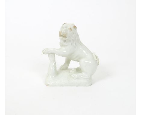 A small Bow white-glazed model of a lioness, c.1752-54, seated on her haunches with head turned to sinister, her left forepaw