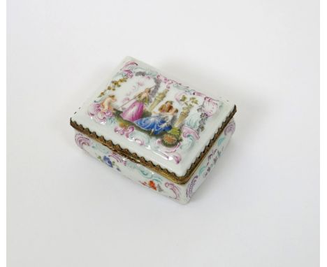 A German porcelain rectangular snuff box, c.1770, perhaps Furstenberg, the lid with moulded and enamelled decoration of a cou