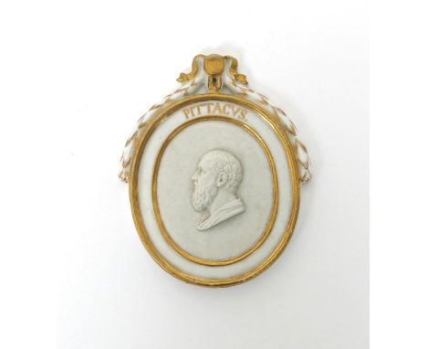 A small Furstenberg portrait plaque of Pittacus, c.1775, the centre oval applied with a finely modelled biscuit profile portr