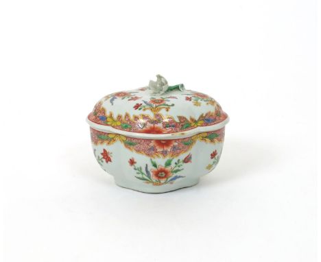 An early Doccia sucrier and cover, c.1750, the quatrefoil form brightly enamelled with sprays of Oriental flowers in the fami