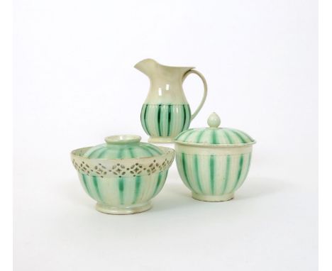 A pearlware part tea service, late 18th/early 19th century, with bands of turned fluting, decorated with washed stripes of gr