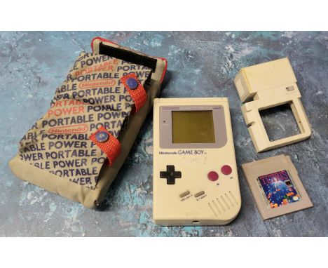 Retro gaming - a Nintendo Gameboy (missing battery cover), Tetris game cartridge, a Nuby Game Light; an official Nintendo Por