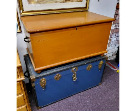 A Victorian painted pine blanket chest; a large blue steamer trunk 