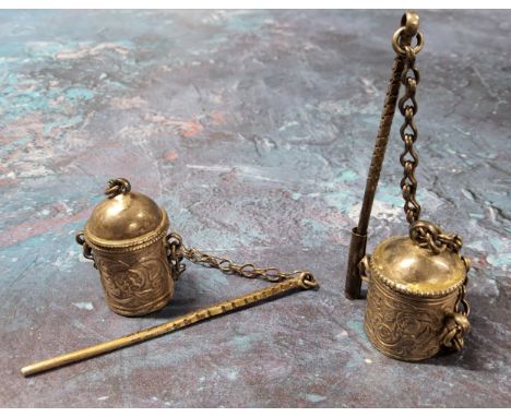 An Omani white metal kohl pot&nbsp;(makhal or makhalah) with kohl stick&nbsp;(mirwad or marwad) attached with a chain, emboss