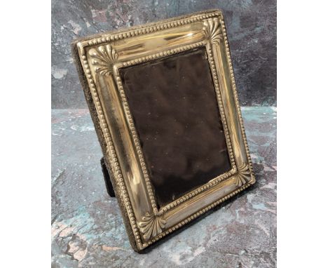 A silver rectangular easel photograph frame, anthemion to angles, 12cm x 10cm, Sheffield 1996 