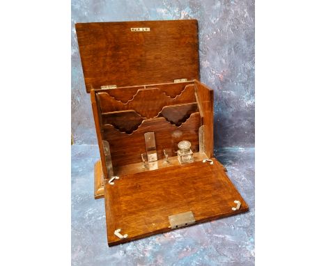 A Victorian oak table top stationery box,&nbsp;the interior with inkwell, waterfall letter rack, writing surface,&nbsp; skirt
