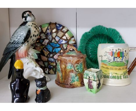 A Fieldings Crown Devon, Widdicombe Fair musical mug, printed marks;&nbsp; &nbsp;a German model, Bird of Prey, 23cm high, pri