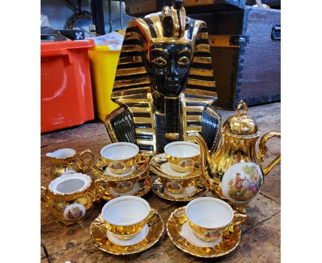 A large ceramic Tutankhamun pharaoh mask, 34cm high, signed Zauotto;&nbsp; a Bondware gilt coffee service 